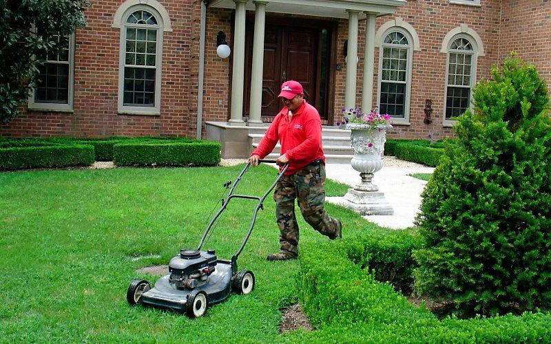 SAB Landscape Tree Service Mowing a Lawn