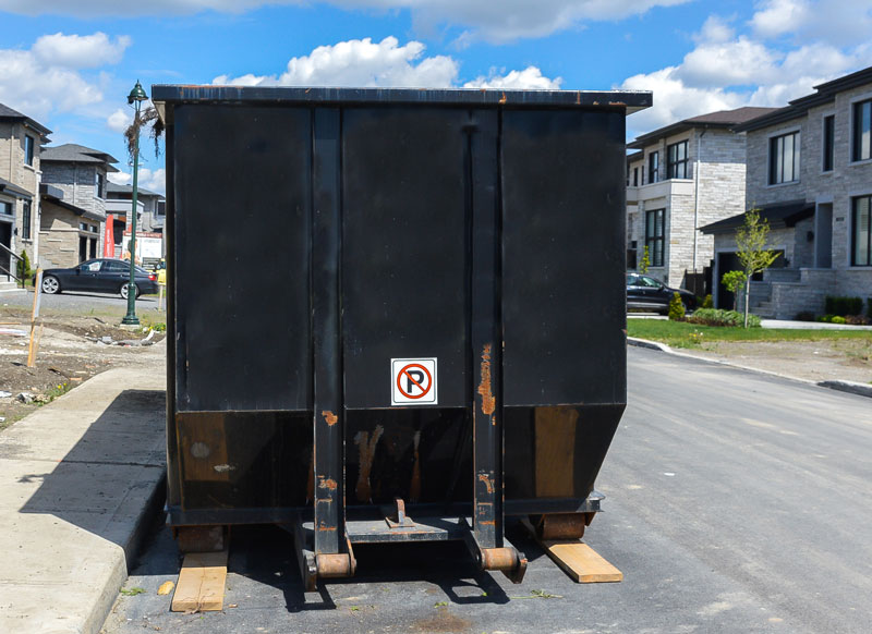 Black Dumpster at a Construction site