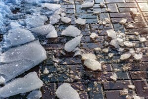 Spring on street, snow melt on square